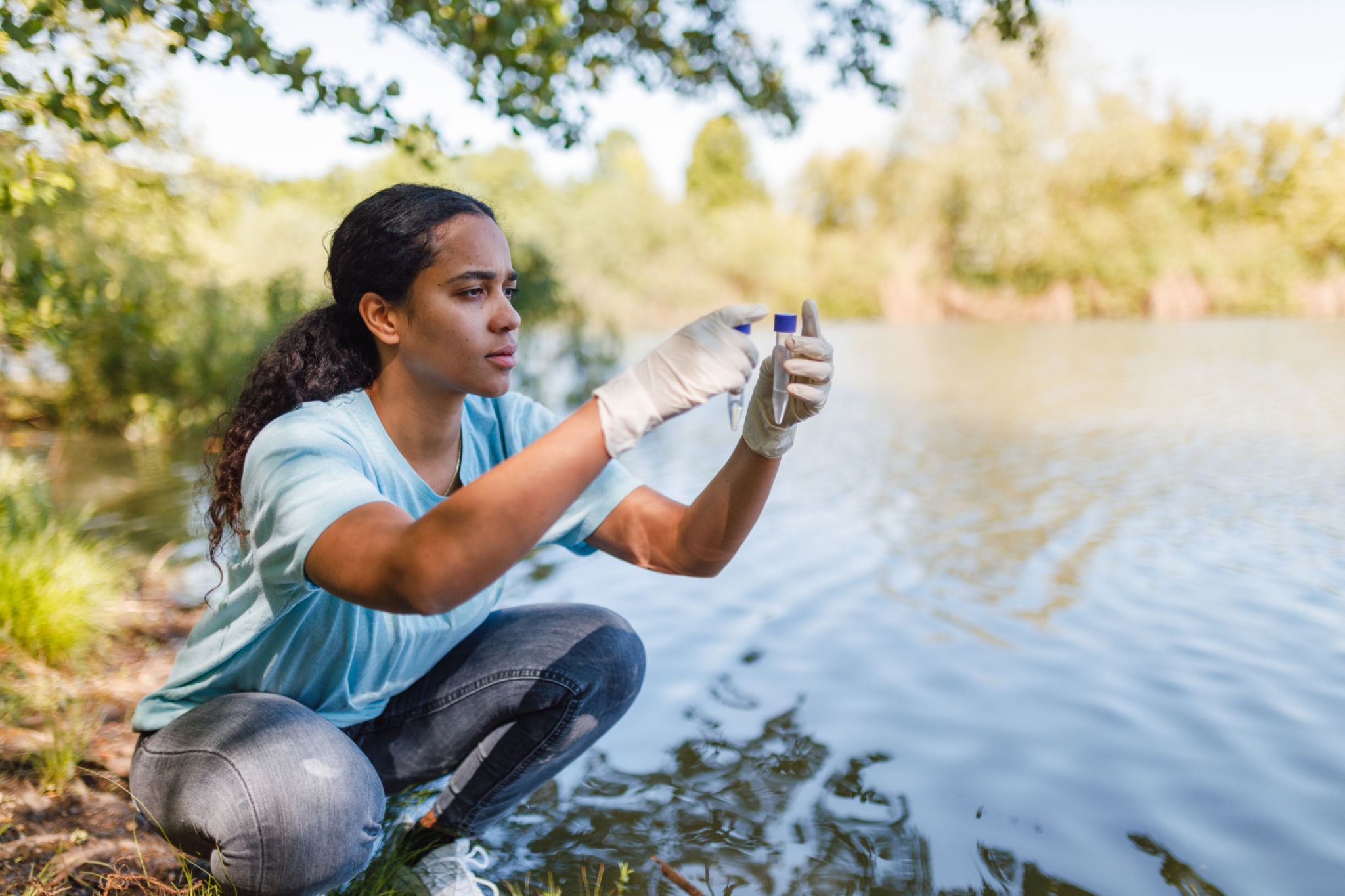 Scientist testing water quality in the field