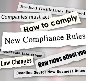 Newspaper headlines about new compliance rules and regulations