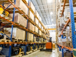 Warehouse facility with forklift and storage racks
